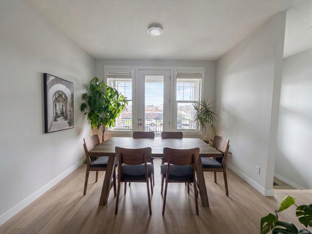 Listing-grade dining room with brighter, balanced light and decluttered surfaces